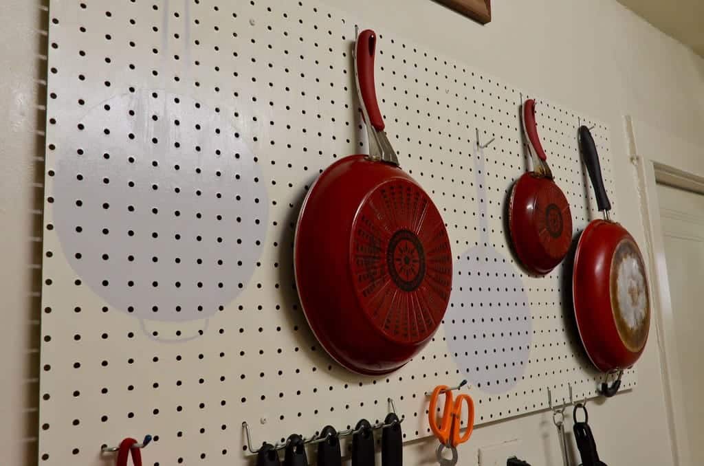 pots and pans storage pegboard used to store pots and pans in the kitchen