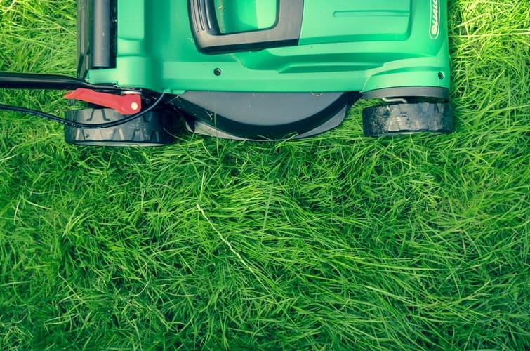 landscaping storage lawn mower on green grass