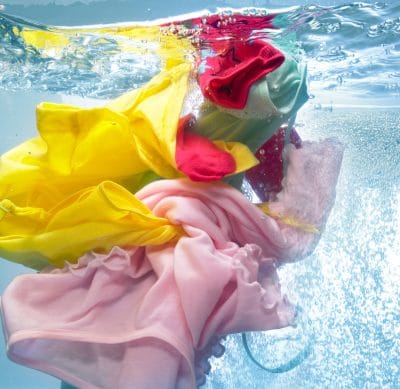 Summer clothes being washed before being stored