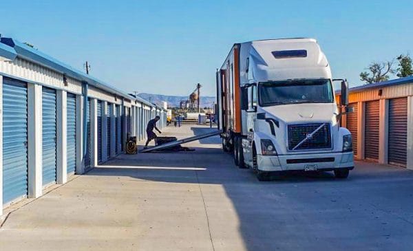 Semi Truck unloading into storage units