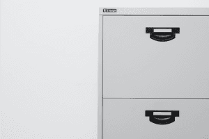 A grey filing cabinet, a good thing to get for home office storage.