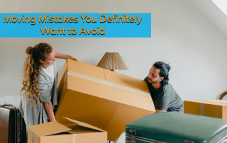 A man and a woman moving a big cardboard box into their home.