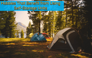 Camping tents that came from a storage unit set up in the wilderness in Colorado with mountains in the background.