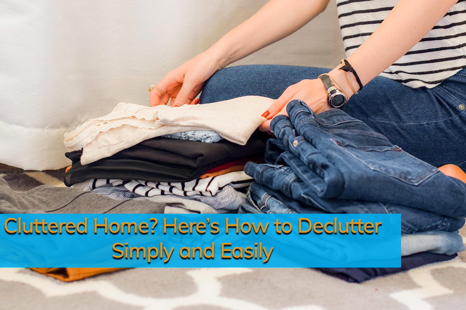 An anonymous person organizing clothes into piles to declutter her home.