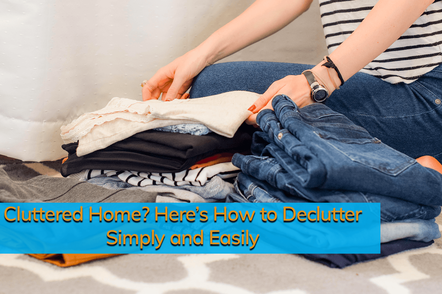 An anonymous person organizing clothes into piles to declutter her home.